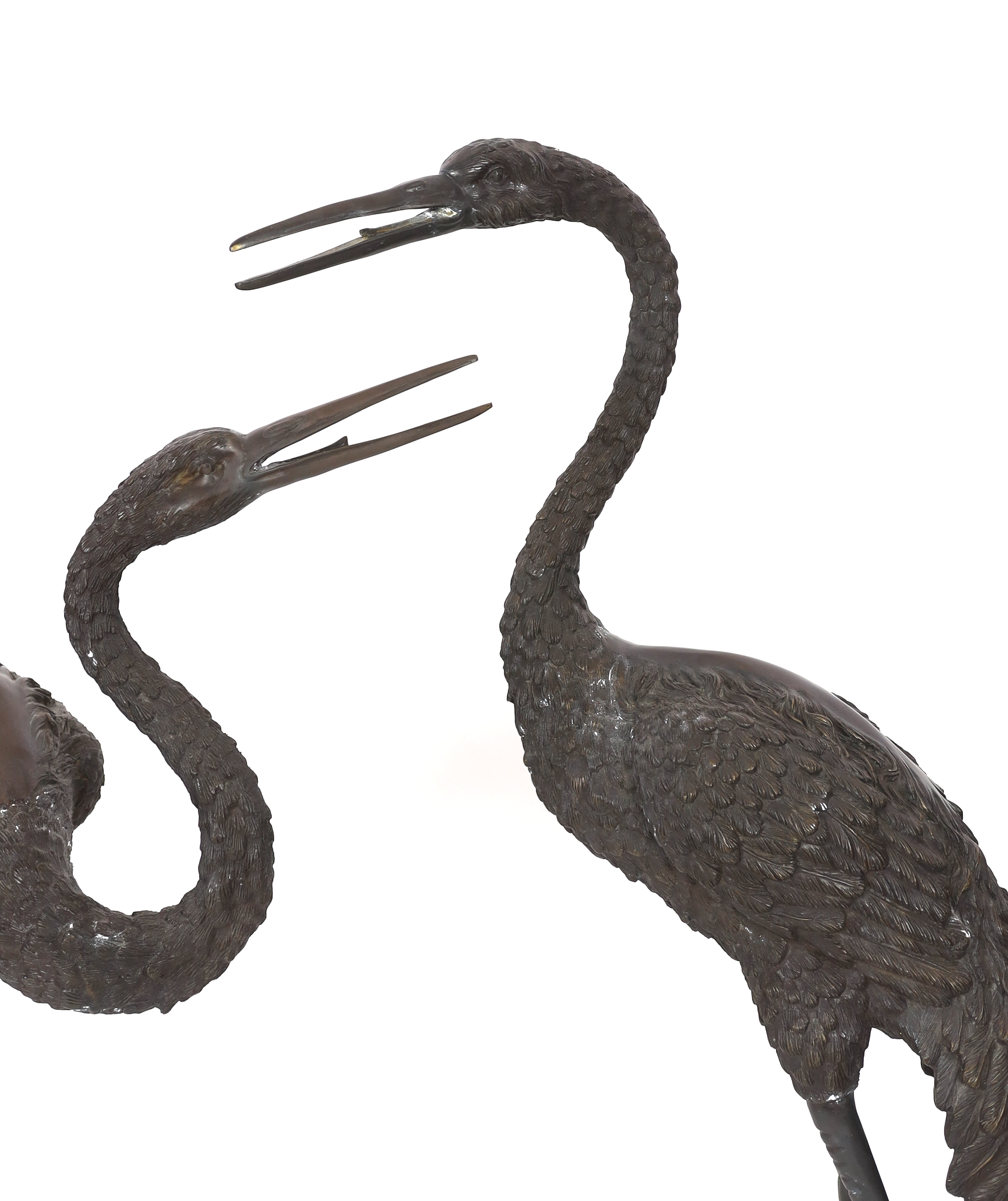 A pair of 20th century Chinese bronze garden models of cranes, 140cm and 157cm high